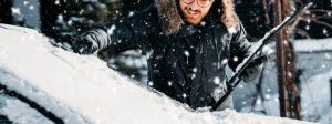 A stock photo of a person pulling up their wiper blade.